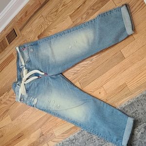 Distressed mid rise jean